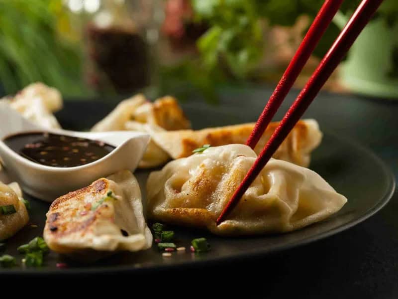 image 247 235 - Chicken Dumplings are a staple in Asian cuisine. Filled with chicken and fresh vegetables, with a delectable range of seasonings, Chicken Dumplings will always leave you wanting more. You can actually make these in less than an hour and there are plenty of them so you can eat them to your heart’s content. Make sure you have plenty of soy sauce for dipping!