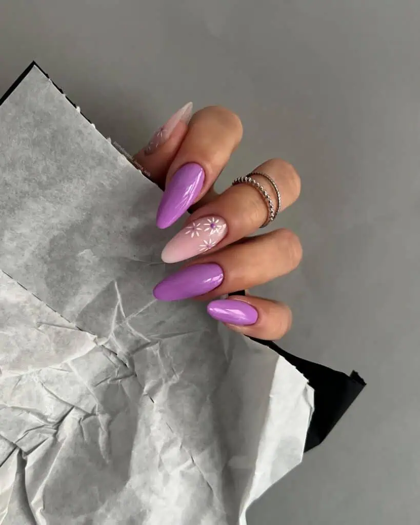 A captivating array of purple nails, featuring a spectrum of shades from soft lilac to deep violet, with sophisticated designs and finishes.