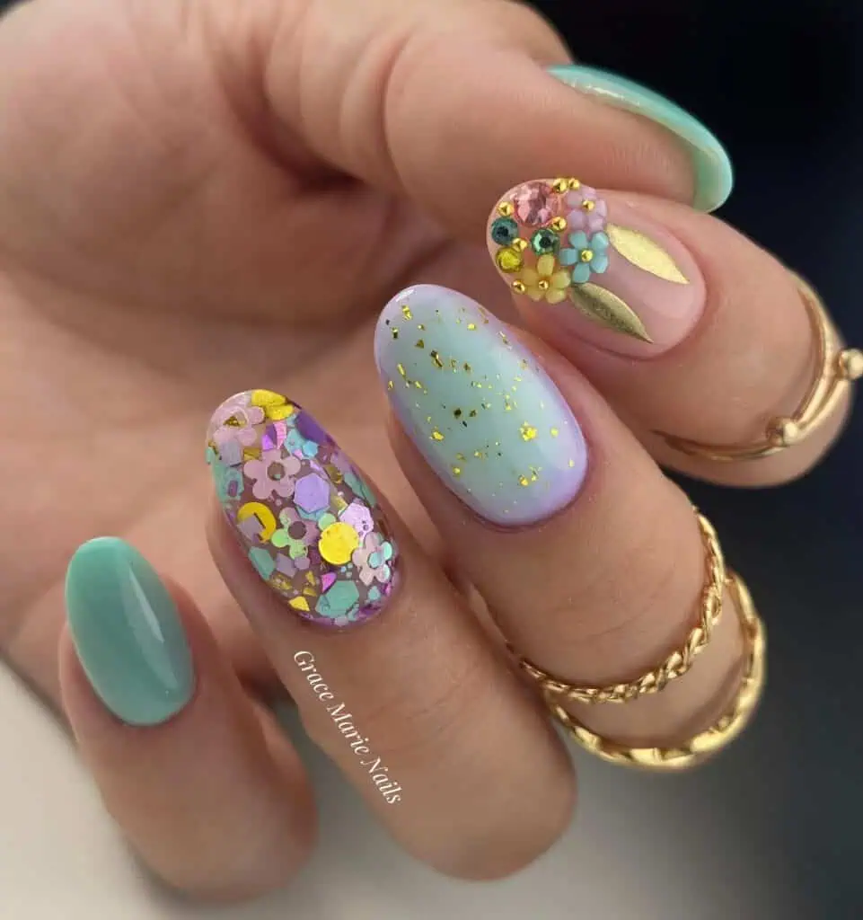 Vibrant springtime acrylic nails in soft pastel shades adorned with floral patterns, ideal for spring break.