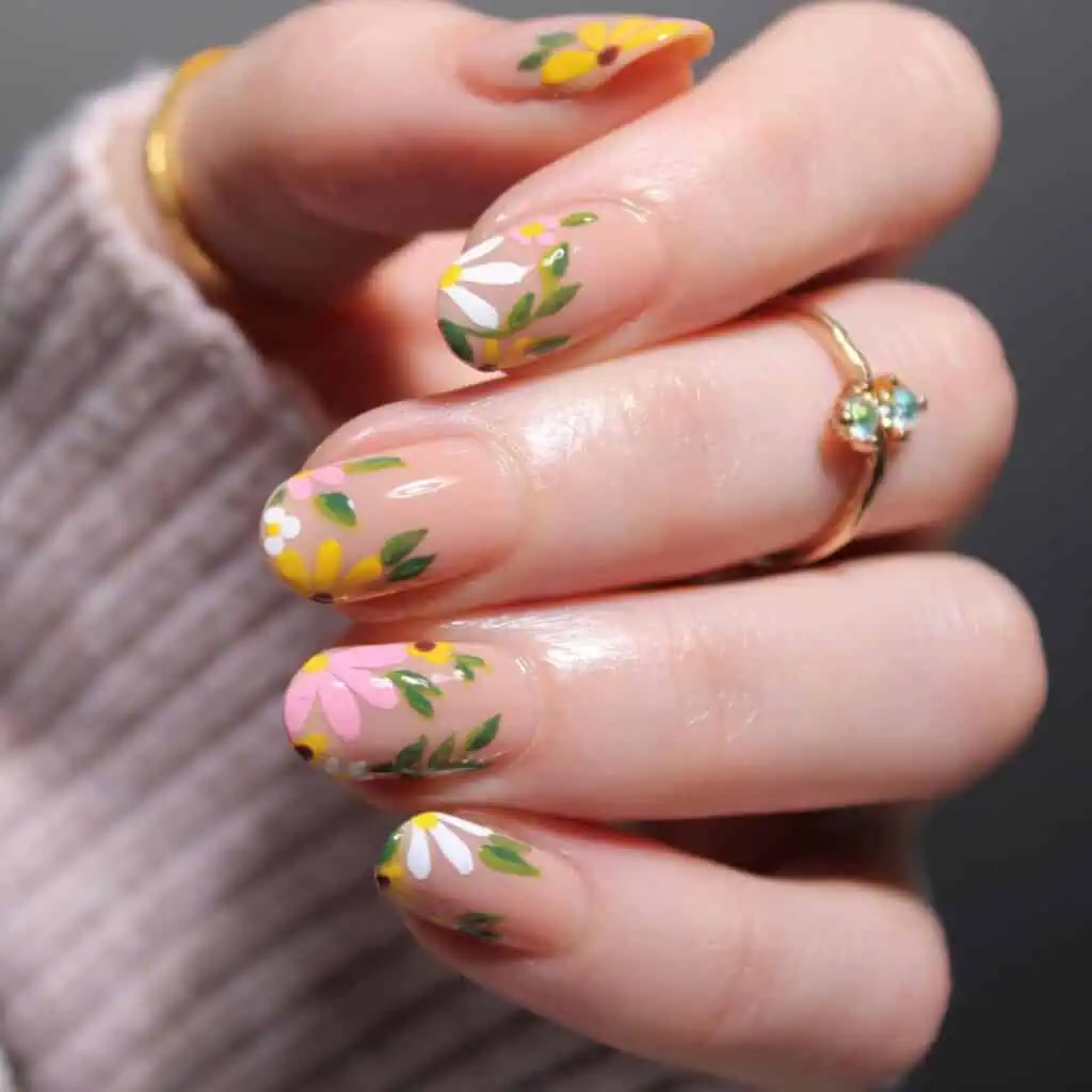 Spring nail designs feature vibrant colors and stylish floral patterns, including ombre nails, coffin shapes, and cute, trendy styles for springtime inspiration.