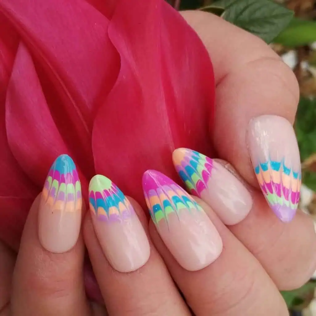 Cheerful and lively summer nail designs with bold hues of azure, rose, and lemon, showcasing seaside themes and flower motifs.