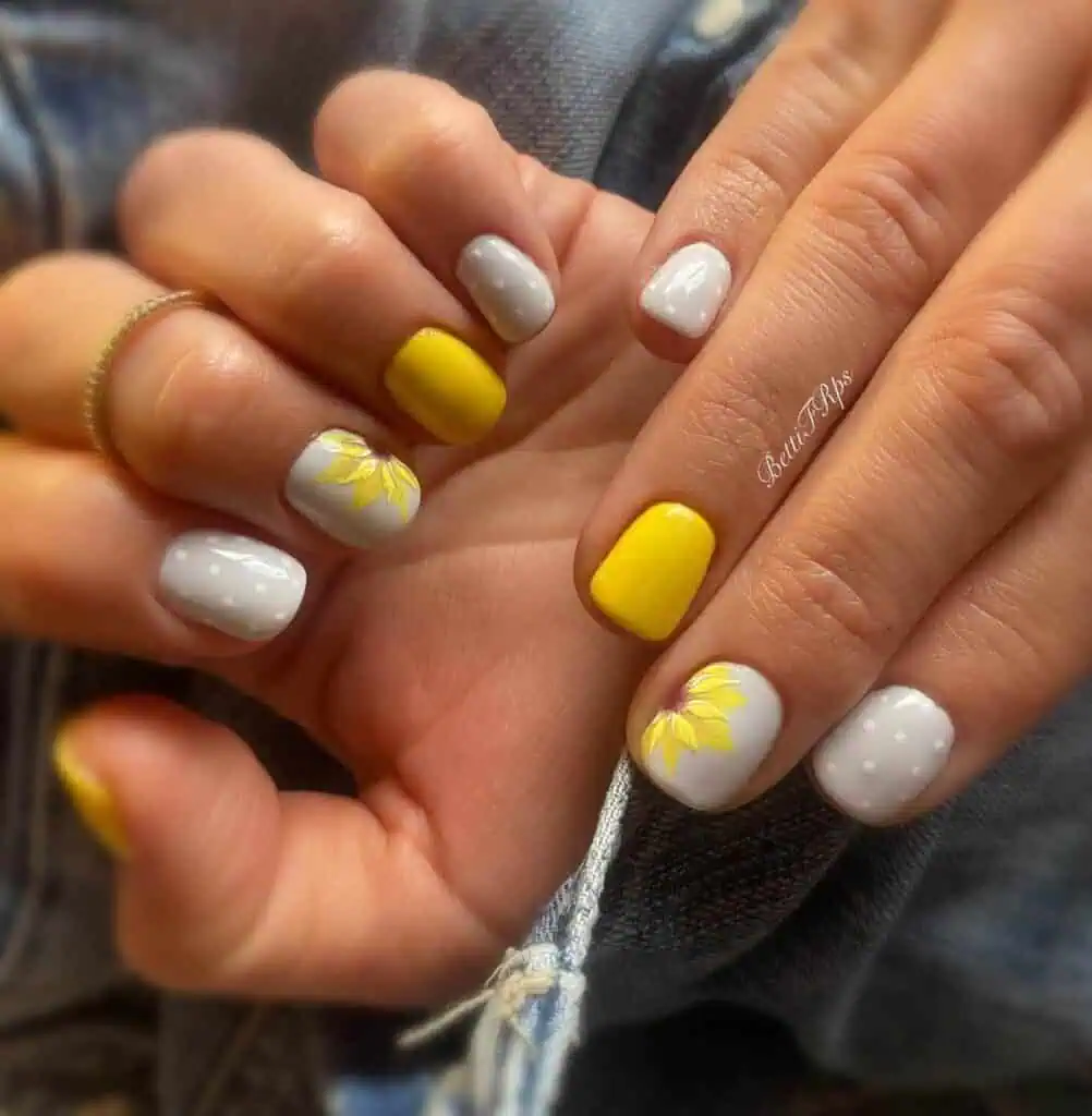 Sophisticated sunflower nail art with detailed patterns on gel and matte finishes, suitable for all seasons.