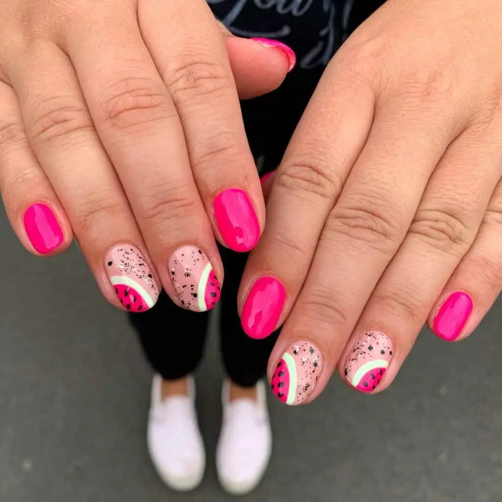 Cheerful watermelon nails with vivid summer shades of pink and green, highlighted by fun black seed accents, ideal for a refreshing summer style.