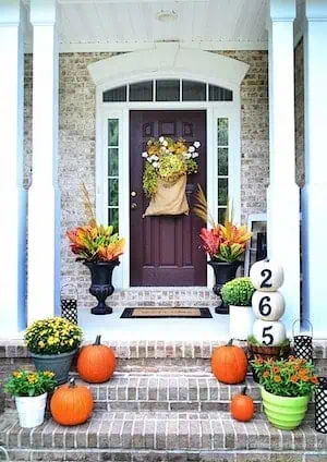 orange and green bright front porch steps and door