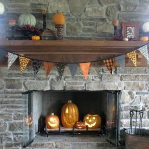 Halloween Mantel with pumpkins in fireplace 