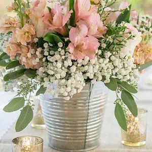 galvanized bucket wedding centerpiece - DIY Rustic Wedding Ideas are the perfect way to bring a sense of warmth, charm, and personalized touches to your special day. Whether you're planning a countryside celebration or simply want to incorporate the beauty of natural elements into your event, rustic wedding themes offer a timeless appeal that resonates with many couples.