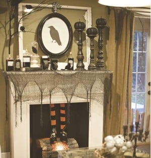  Halloween Party Mantel with crow wall art, creepy cloth and black candlesticks 