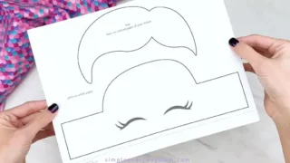 Hands holding unicorn headband template